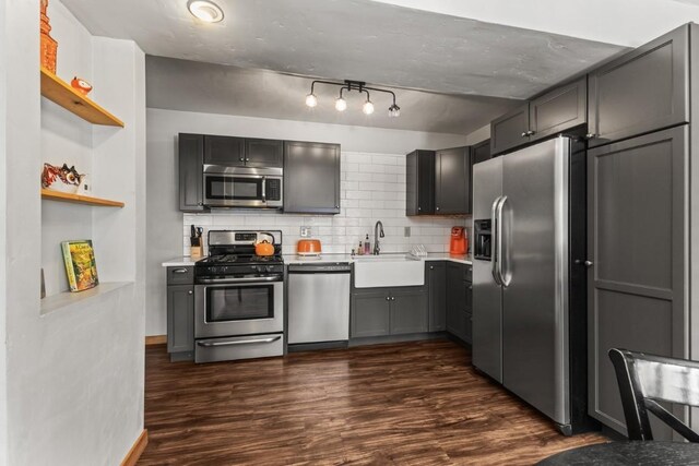 32 Sequoia Court -, Steamboat Springs, CO 80487 - kitchen with open shelves, stainless steel appliances, light countertops, and a sink