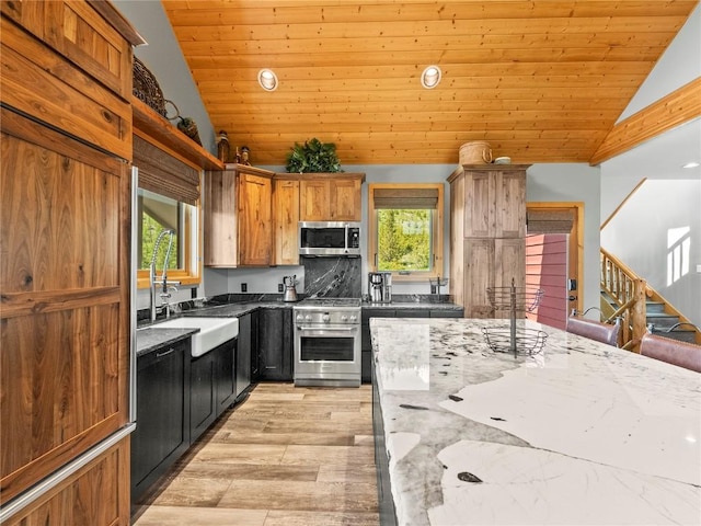 89 Emerald Rd, Silverthorne, CO 80498 - kitchen with appliances with stainless steel finishes, lofted ceiling, wood ceiling, recessed lighting, and dark stone countertops