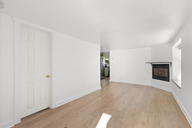 unfurnished living room featuring light hardwood / wood-style floors