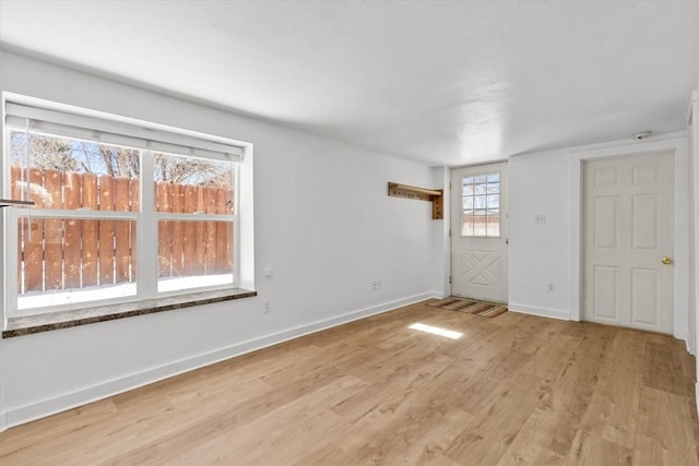 spare room featuring light hardwood / wood-style flooring