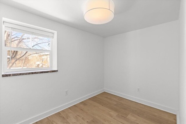 spare room featuring hardwood / wood-style flooring