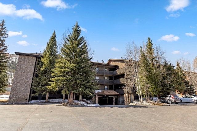view of property with uncovered parking