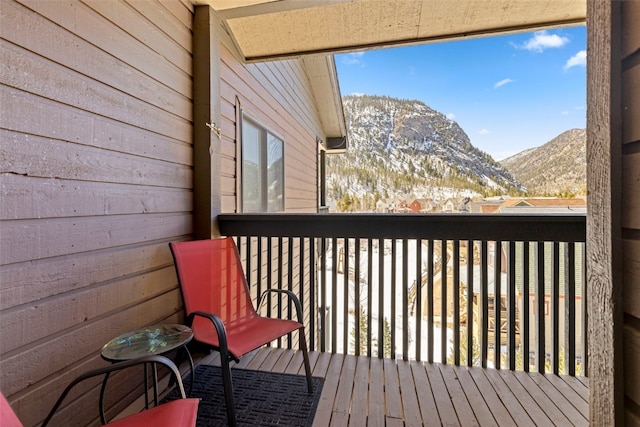 wooden terrace with a mountain view