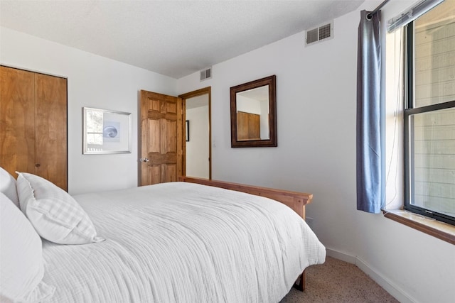 bedroom featuring carpet, visible vents, and baseboards