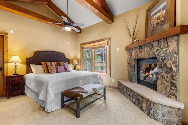2137 Overlook Ln Unit 104, Steamboat Springs, CO 80487 - carpeted bedroom with a stone fireplace, a ceiling fan, and baseboards