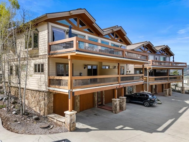 2137 Overlook Ln Unit 104, Steamboat Springs, CO 80487 - view of building exterior with driveway and an attached garage