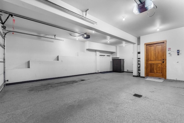 2137 Overlook Ln Unit 104, Steamboat Springs, CO 80487 - garage with a garage door opener and baseboards