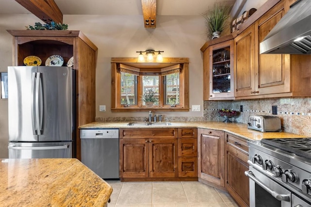 2137 Overlook Ln Unit 104, Steamboat Springs, CO 80487 - kitchen with stainless steel appliances, extractor fan, a sink, beam ceiling, and brown cabinetry