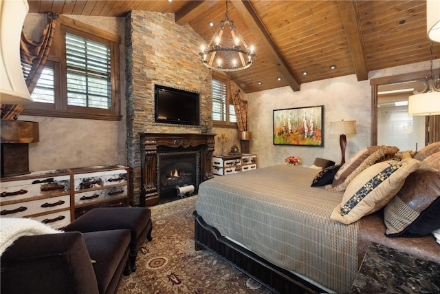 bedroom featuring a chandelier, wooden ceiling, beamed ceiling, and a lit fireplace