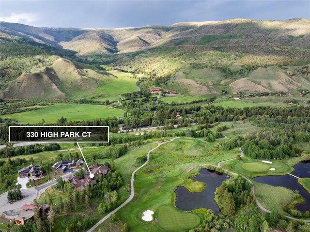 bird's eye view featuring a water and mountain view