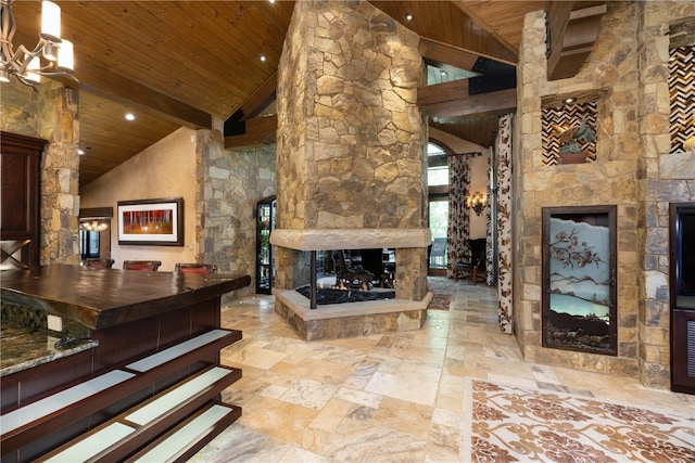 living area with arched walkways, an outdoor stone fireplace, wood ceiling, high vaulted ceiling, and beamed ceiling