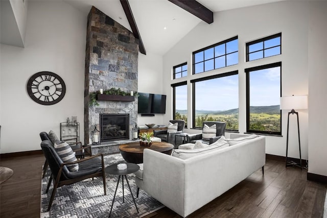 living room featuring dark wood-style floors, beamed ceiling, a stone fireplace, and high vaulted ceiling