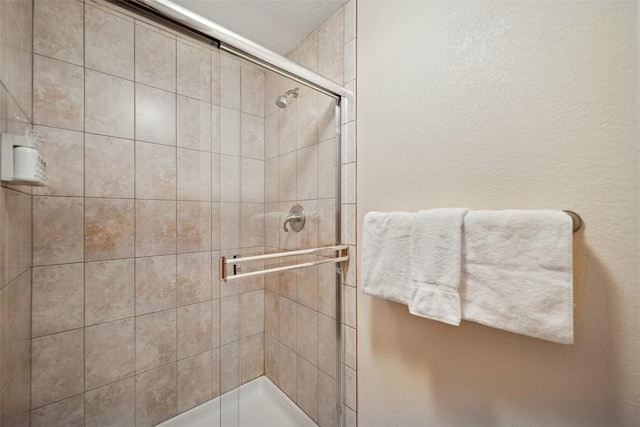 bathroom featuring a shower stall