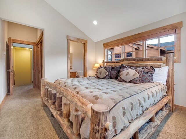 carpeted bedroom featuring baseboards, vaulted ceiling, ensuite bath, and recessed lighting
