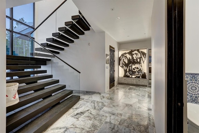 stairway with marble finish floor