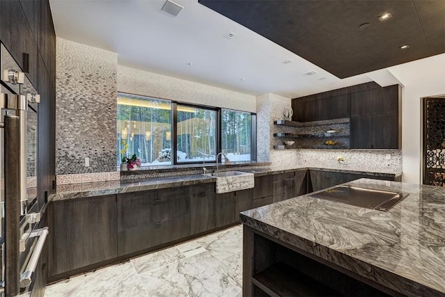kitchen featuring modern cabinets, backsplash, stovetop, and open shelves