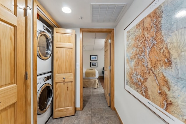 502 Northstar Dr Unit 1947, Keystone, CO 80435 - laundry area with stacked washer / drying machine, baseboards, and tile patterned floors