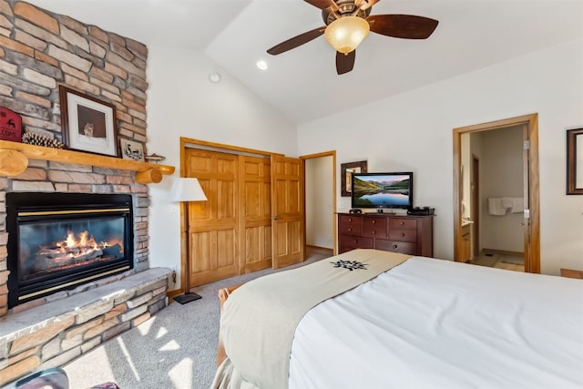502 Northstar Dr Unit 1947, Keystone, CO 80435 - carpeted bedroom featuring a stone fireplace, high vaulted ceiling, ensuite bathroom, and a ceiling fan