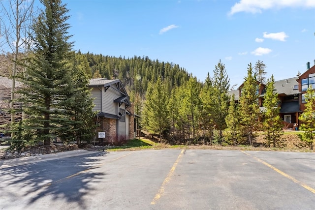 502 Northstar Dr Unit 1947, Keystone, CO 80435 - view of asphalt street featuring a wooded view