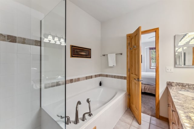 502 Northstar Dr Unit 1947, Keystone, CO 80435 - ensuite bathroom featuring vanity, a bath, tile patterned floors, and tiled shower