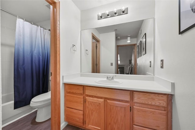 100 S Park Ave Unit E312, Breckenridge, CO 80424 - bathroom featuring toilet, vanity, wood finished floors, and shower / bath combination with curtain