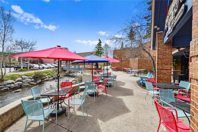 100 S Park Ave Unit E312, Breckenridge, CO 80424 - view of patio featuring outdoor dining area and a water view