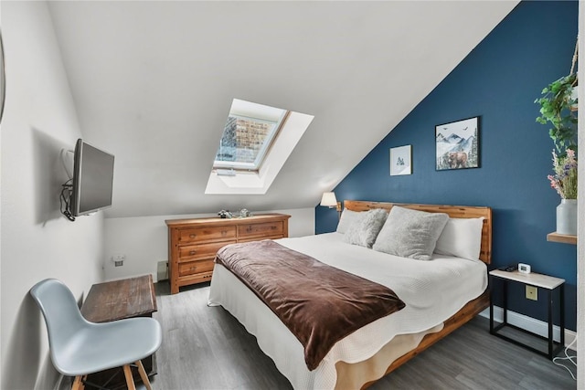 100 S Park Ave Unit E312, Breckenridge, CO 80424 - bedroom featuring wood finished floors, vaulted ceiling, and a skylight