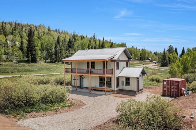25640 6th Ave, Hahns Peak, CO 80428 - view of front of home with a balcony and metal roof