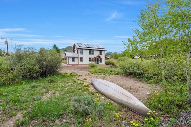 25640 6th Ave, Hahns Peak, CO 80428 - back of house featuring roof mounted solar panels