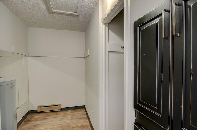 3020 Village Dr Unit 222, Steamboat Springs, CO 80487 - walk in closet featuring baseboard heating and light wood-style flooring