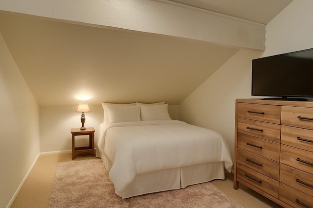3020 Village Dr Unit 222, Steamboat Springs, CO 80487 - bedroom featuring vaulted ceiling and light colored carpet