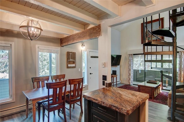 3020 Village Dr Unit 222, Steamboat Springs, CO 80487 - dining area with a baseboard heating unit, wood finished floors, a chandelier, and a wooden ceiling with exposed beams