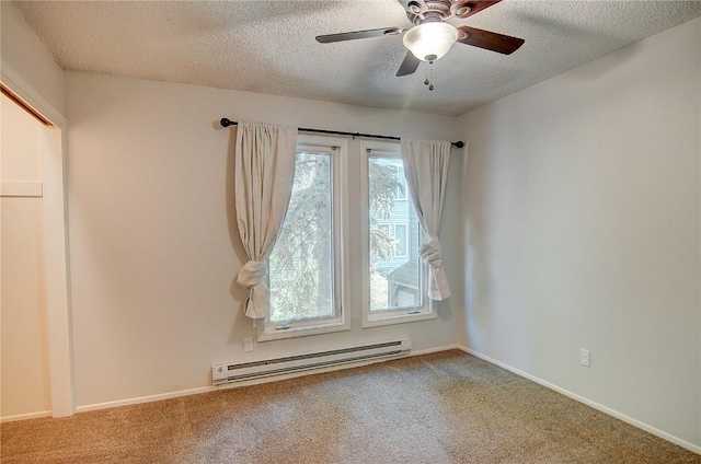 3020 Village Dr Unit 222, Steamboat Springs, CO 80487 - spare room with baseboard heating, carpet floors, a textured ceiling, and a ceiling fan