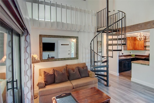 3020 Village Dr Unit 222, Steamboat Springs, CO 80487 - living area featuring stairway and light wood-style floors