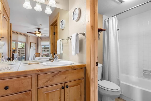 2700 Village Dr Unit 301, Steamboat Springs, CO 80487 - full bathroom with toilet, vanity, ceiling fan, and shower / bathtub combination with curtain