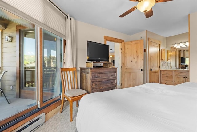 2700 Village Dr Unit 301, Steamboat Springs, CO 80487 - carpeted bedroom featuring a baseboard radiator, access to outside, ensuite bathroom, and ceiling fan