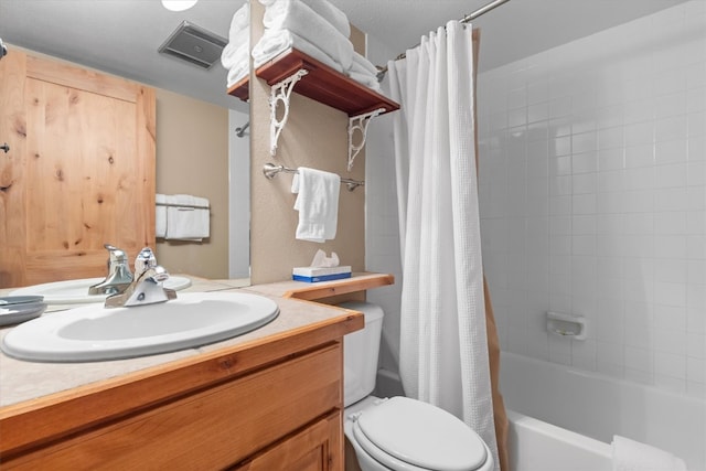 2700 Village Dr Unit 301, Steamboat Springs, CO 80487 - bathroom featuring toilet, shower / bath combo with shower curtain, and vanity
