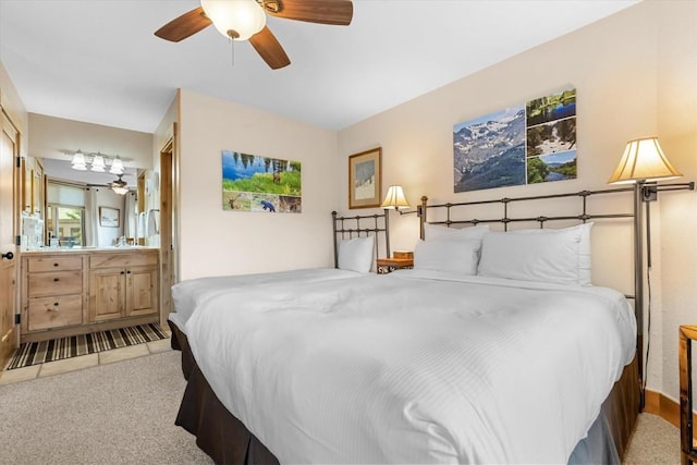 2700 Village Dr Unit 301, Steamboat Springs, CO 80487 - carpeted bedroom featuring a ceiling fan and ensuite bath