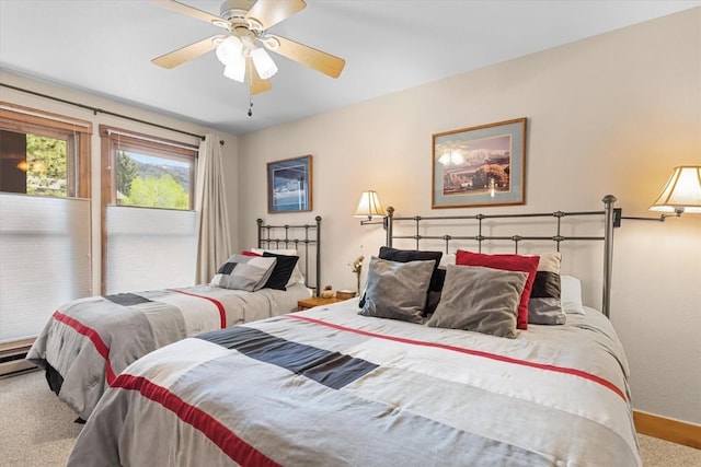 2700 Village Dr Unit 301, Steamboat Springs, CO 80487 - carpeted bedroom featuring baseboards and a ceiling fan