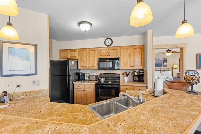 2700 Village Dr Unit 301, Steamboat Springs, CO 80487 - kitchen featuring black appliances, a sink, tile countertops, and a ceiling fan