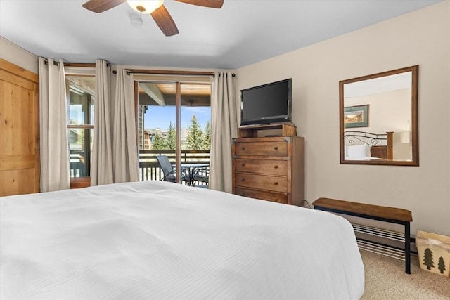 2700 Village Dr Unit 301, Steamboat Springs, CO 80487 - bedroom featuring access to outside, carpet floors, ceiling fan, and a baseboard radiator