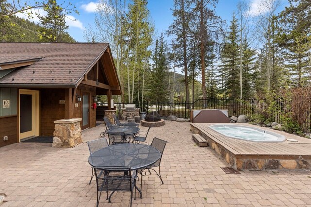 102 Lake Ridge Cir Unit 1887, Keystone, CO 80435 - view of patio / terrace with an outdoor hot tub and outdoor dining space