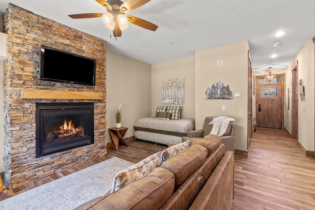 102 Lake Ridge Cir Unit 1887, Keystone, CO 80435 - living area with wood-type flooring, a ceiling fan, a fireplace, recessed lighting, and baseboards
