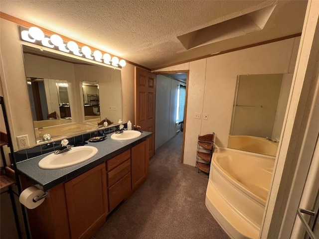315 E 1st St, Oak Creek, CO 80467 - bathroom featuring a sink, a textured ceiling, double vanity, lofted ceiling, and a garden tub