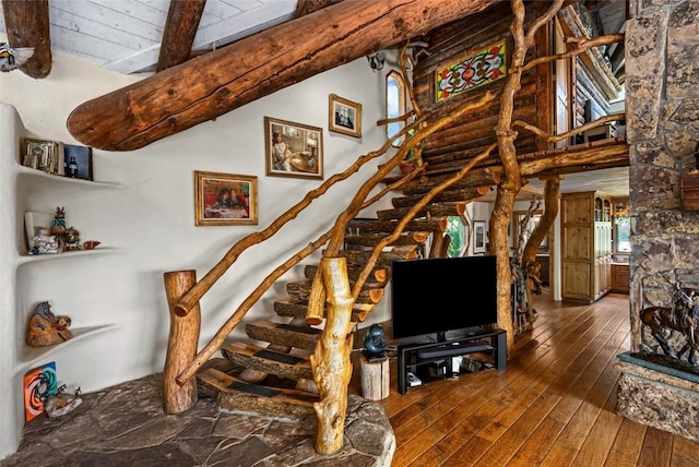 2350 Glacier Rdg, Steamboat Springs, CO 80487 - stairs with beamed ceiling, hardwood / wood-style floors, and high vaulted ceiling