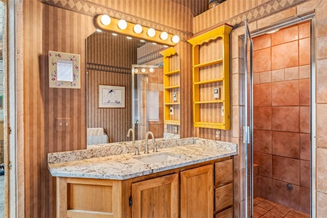 2350 Glacier Rdg, Steamboat Springs, CO 80487 - full bathroom featuring tile patterned floors, wallpapered walls, a shower stall, and vanity
