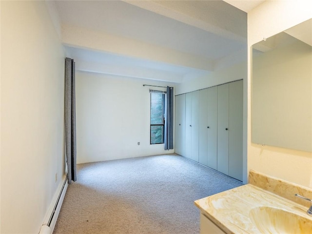 bathroom with vanity and baseboard heating