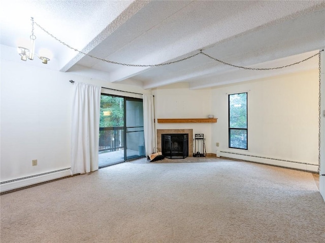 unfurnished living room with a tile fireplace, a baseboard radiator, beam ceiling, and a textured ceiling