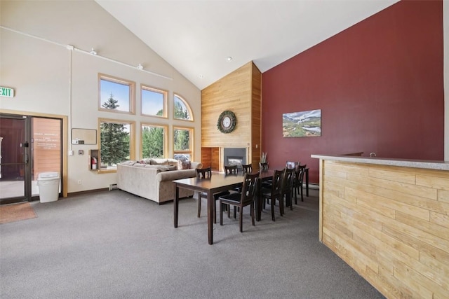 17 James Ct, Dillon, CO 80435 - carpeted dining space with high vaulted ceiling, a fireplace, and a community bar