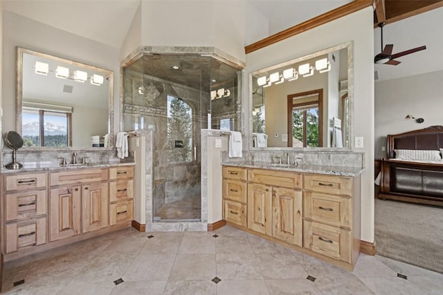 17 James Ct, Dillon, CO 80435 - full bathroom featuring a shower stall, two vanities, a ceiling fan, and tile patterned flooring
